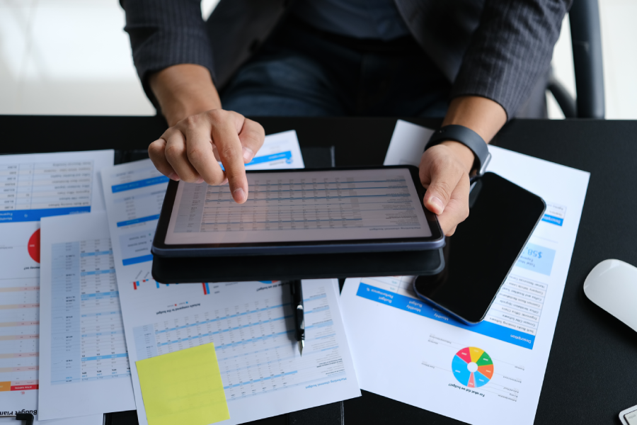 cropped-shot-of-male-economist-in-suit-preparing