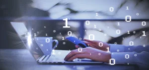 side-view-of-male-hands-using-smartphone-and-laptop